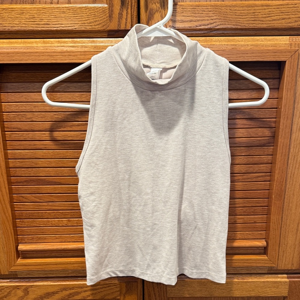Yogalicious Women's Sleeveless Mock Neck Muscle Tee in Light Beige